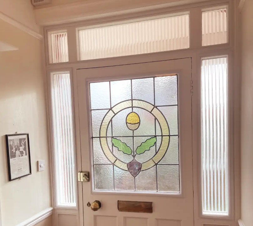Front door and surround with single glazed stained and decorative glass